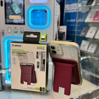 Photograph of an Esoulk Magnetic Wallet with Foldable Stand product box and an iPhone in a clear case with a red-burgundy magnetic wallet attached, displayed on a glass counter in an electronics store with blue glowing display cases and a $10.00 price tag visible