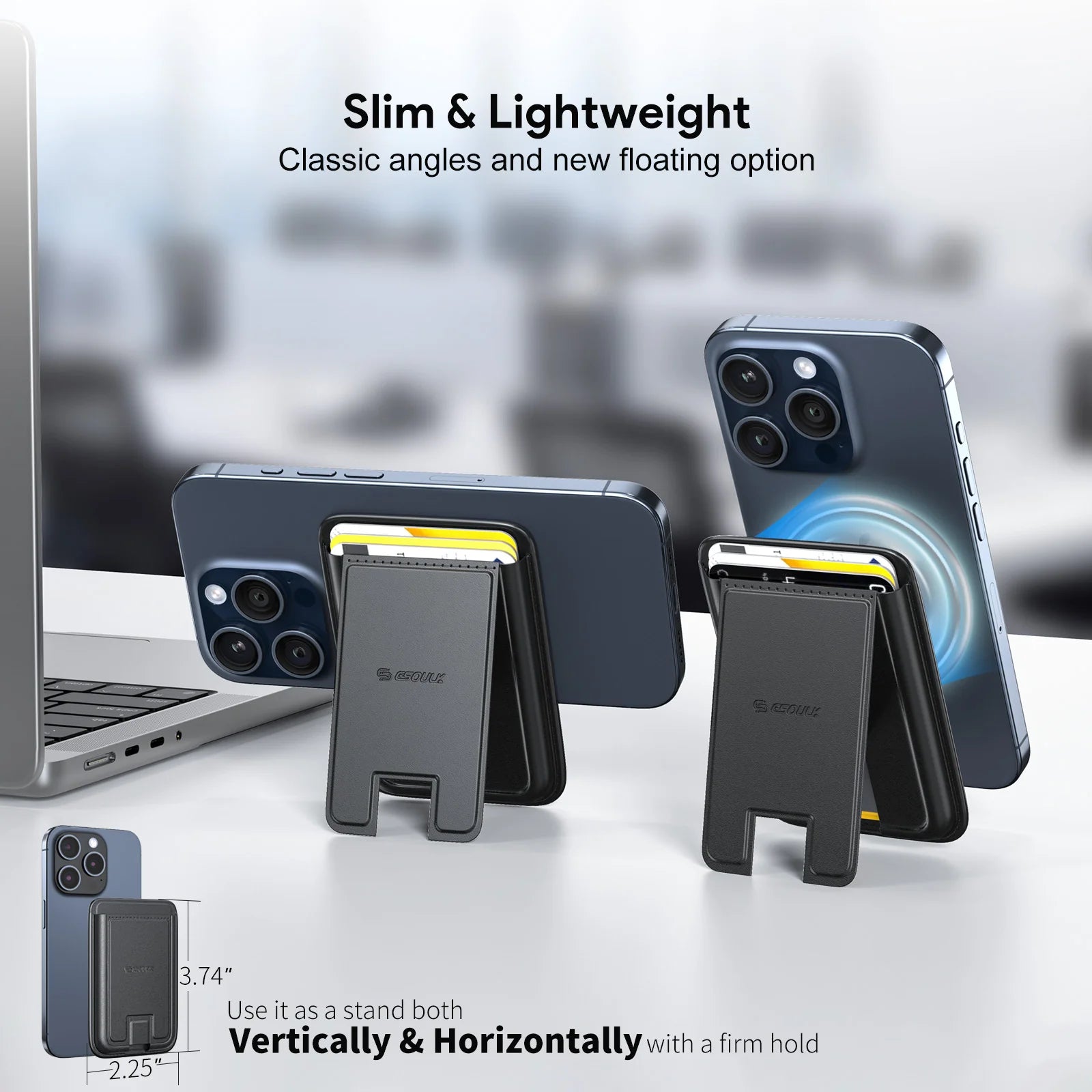 Product image displaying two dark grey GSouu magnetic phone wallet stands, one supporting a blue smartphone horizontally with a visible yellow card, the other holding a blue smartphone vertically with a magnetic blue swirl, on a bright white desk next to a silver laptop