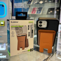 An ESOUK tan magnetic wallet with a foldable stand attached to a black carbon fiber iPhone case, displayed next to its $10.00 retail packaging against a blurred background with a bright blue glowing sign