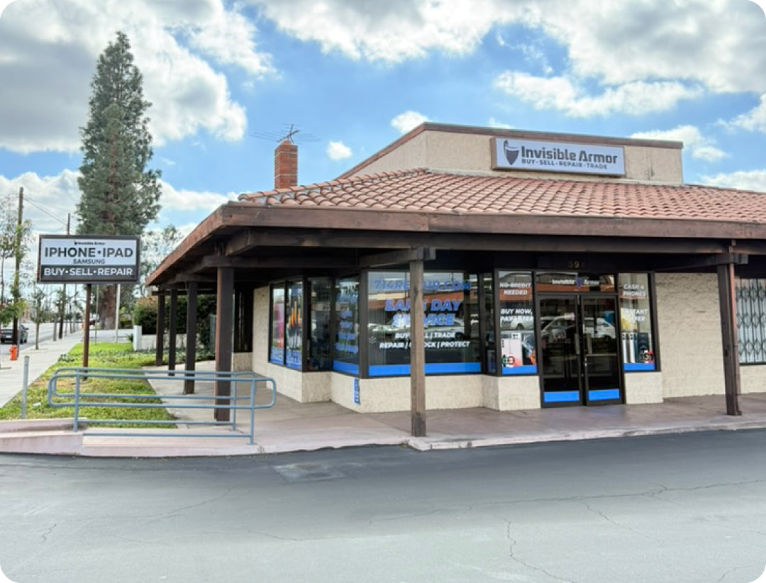 Storefront with 'Invisible Armor' sign on a cloudy day